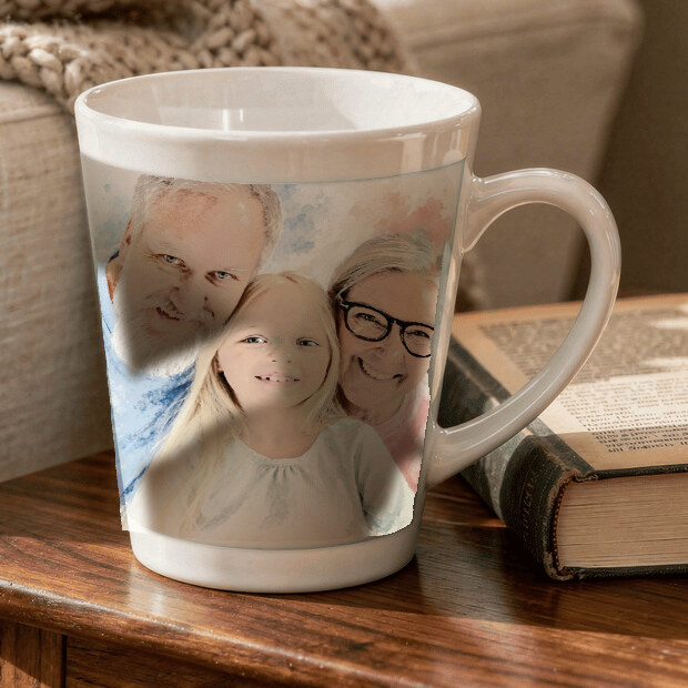 Signature Watercolor made from grandparents smiling with their granddaughter at home, shown as a ceramic latte mug